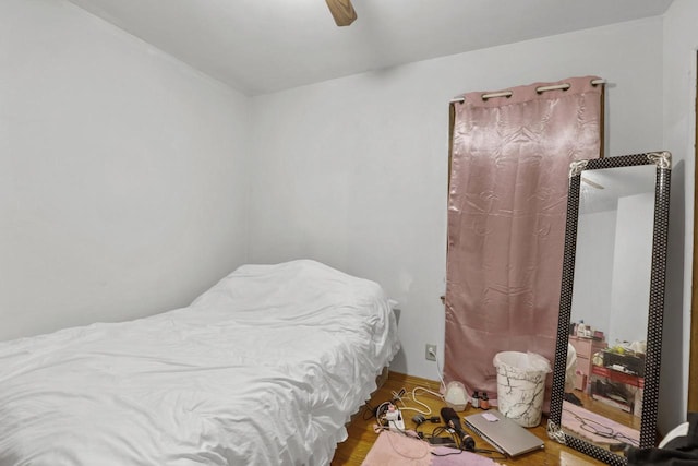 bedroom featuring hardwood / wood-style floors and ceiling fan