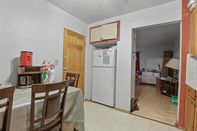 dining space with light wood-type flooring