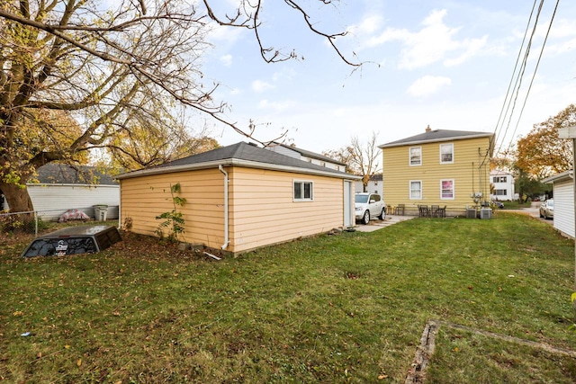 rear view of house with a yard