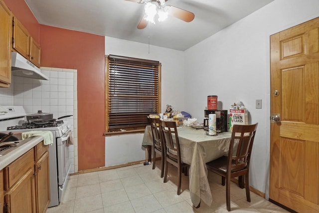 dining room featuring ceiling fan