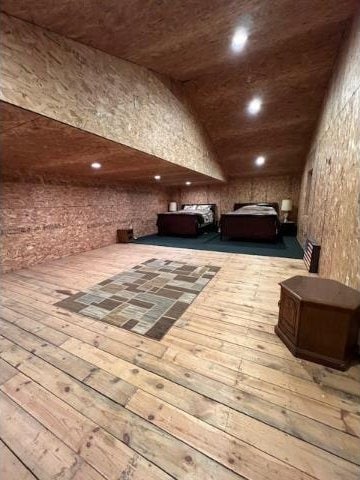 interior space featuring light wood-type flooring and lofted ceiling