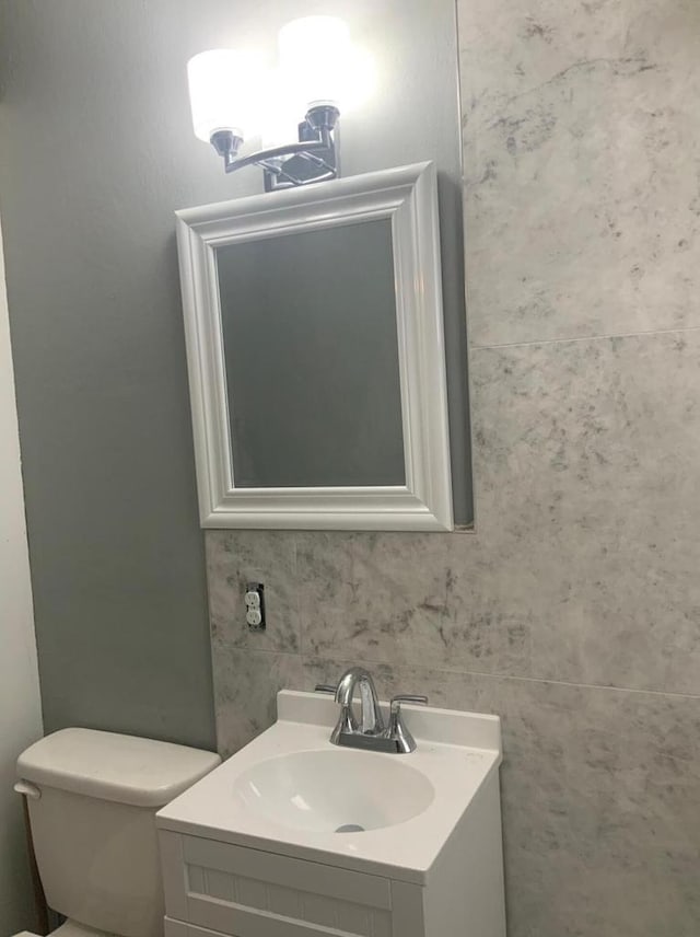 bathroom with toilet and vanity