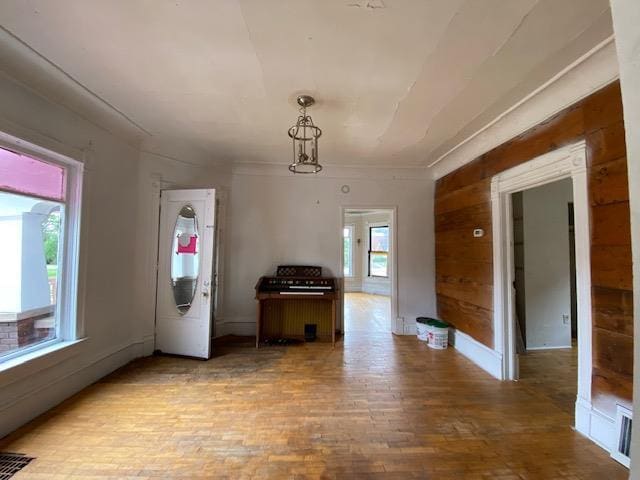 interior space featuring wooden walls and hardwood / wood-style flooring