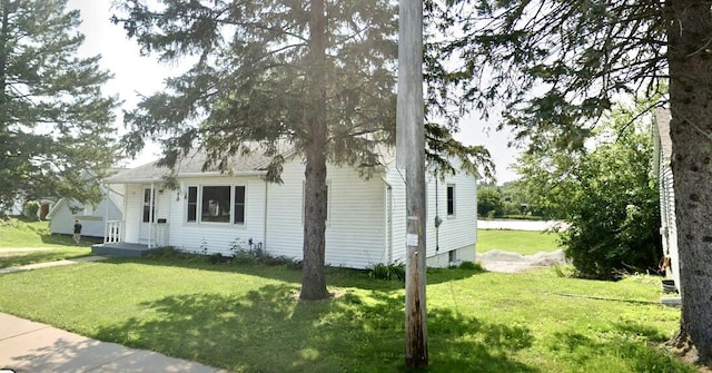 view of home's exterior featuring a lawn