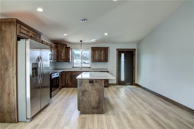 1805 11th Ave Lot 19, Menomonie, WI 54751 - kitchen featuring appliances with stainless steel finishes, light countertops, a kitchen island, light wood-style flooring, and recessed lighting