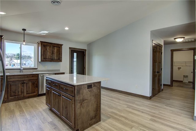1805 11th Ave Lot 19, Menomonie, WI 54751 - kitchen with dishwasher, light wood-style flooring, a sink, baseboards, and a center island