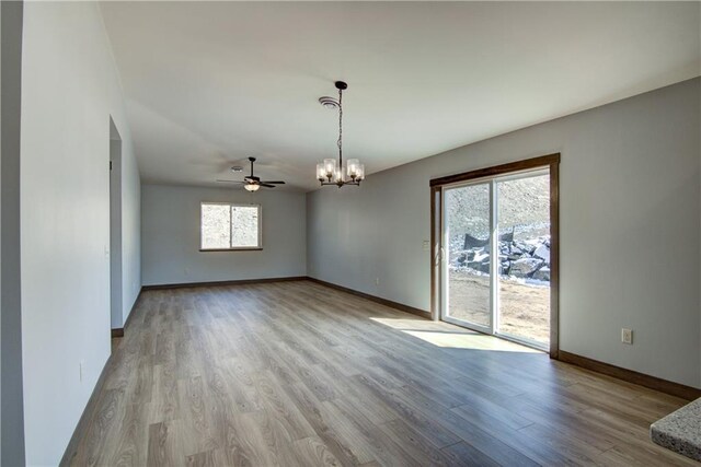 1805 11th Ave Lot 19, Menomonie, WI 54751 - unfurnished room with a chandelier, wood finished floors, baseboards, and a ceiling fan