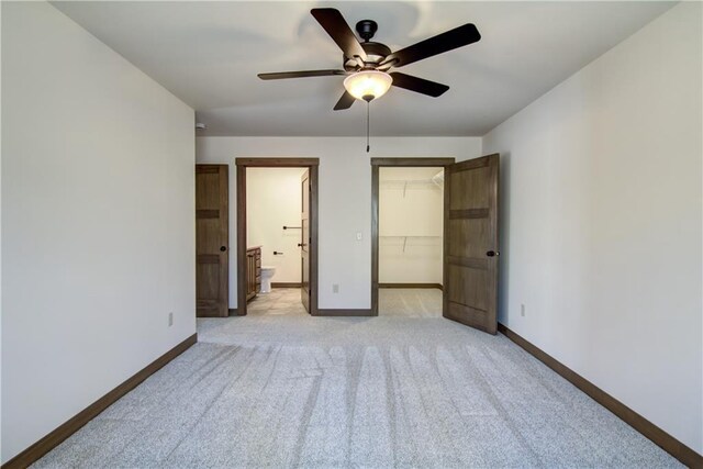 1805 11th Ave Lot 19, Menomonie, WI 54751 - unfurnished bedroom featuring baseboards, light carpet, a spacious closet, a closet, and ensuite bathroom