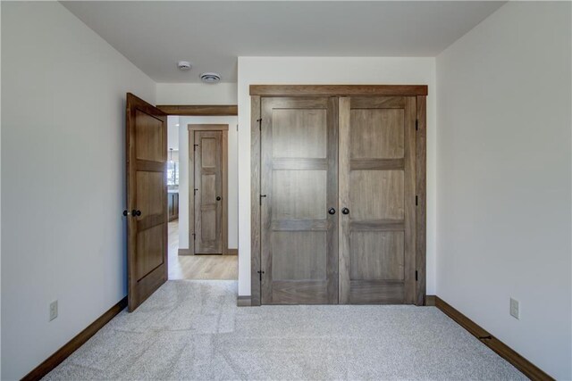1805 11th Ave Lot 19, Menomonie, WI 54751 - unfurnished bedroom featuring carpet, baseboards, and a closet
