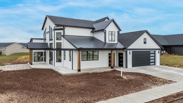 modern farmhouse style home with a garage and a porch