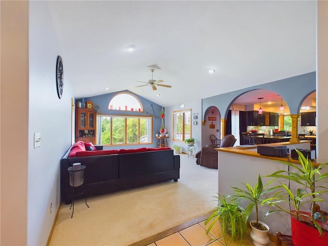 carpeted living room with lofted ceiling and ceiling fan