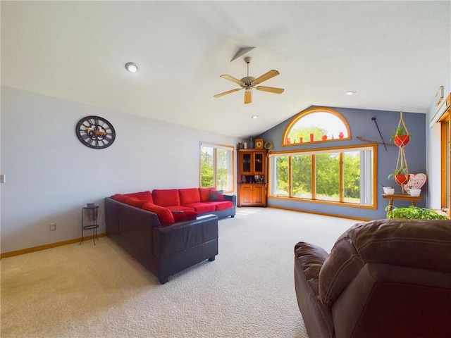 carpeted living room featuring ceiling fan and lofted ceiling