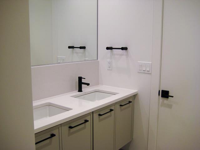 bathroom with double vanity