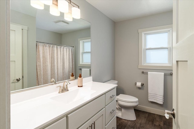 bathroom featuring hardwood / wood-style floors, vanity, and toilet