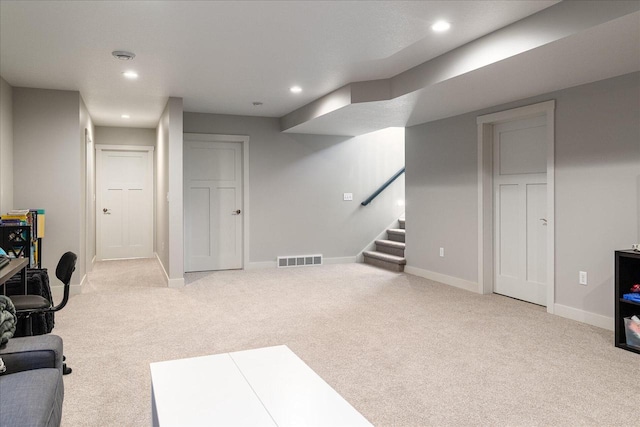 interior space featuring light colored carpet