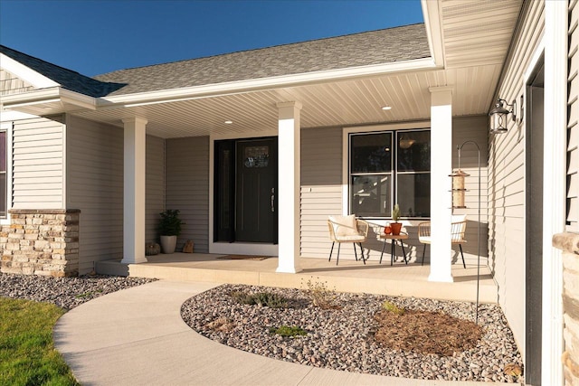 doorway to property featuring covered porch