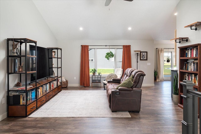 living room with dark wood-type flooring, high vaulted ceiling, ceiling fan, and plenty of natural light