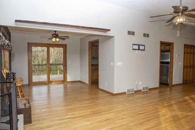 living room featuring ceiling fan and light hardwood / wood-style floors