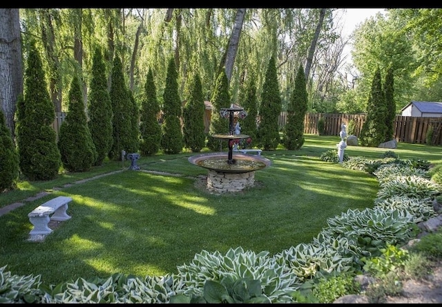 view of home's community featuring a lawn