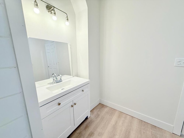 bathroom featuring wood-type flooring and vanity