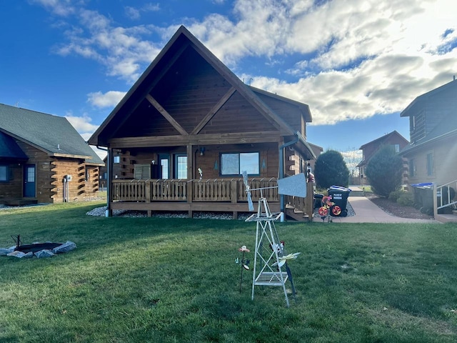 rear view of property with a lawn