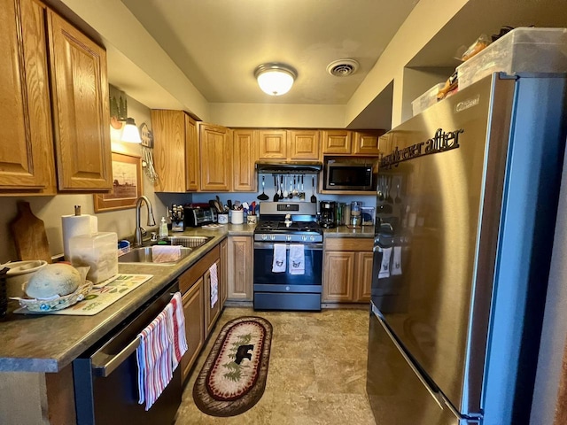 kitchen featuring stainless steel appliances and sink