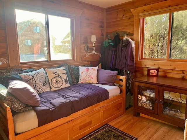 interior space featuring wood walls and hardwood / wood-style flooring