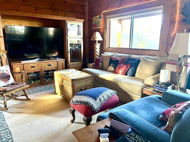 living room with wood walls and carpet