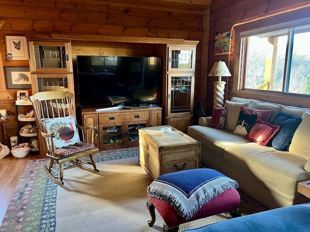 living room featuring wooden walls and wood-type flooring