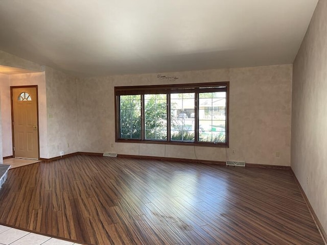 spare room with hardwood / wood-style floors