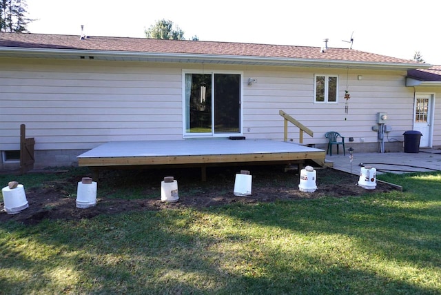 back of property with a patio area, a yard, and a deck