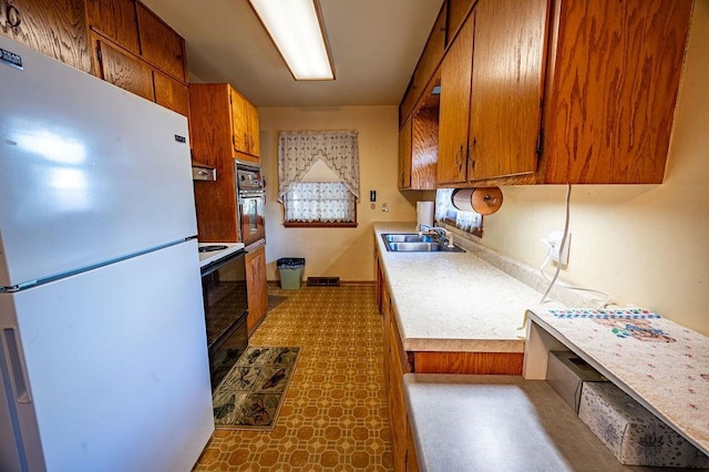 kitchen with white appliances and sink