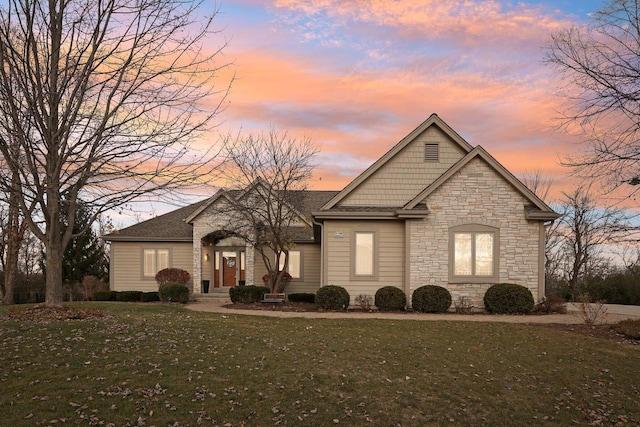 view of front of property with a yard