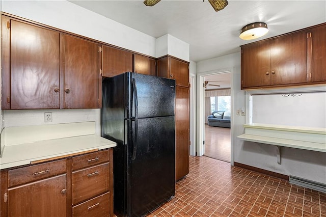 kitchen featuring black fridge and ceiling fan