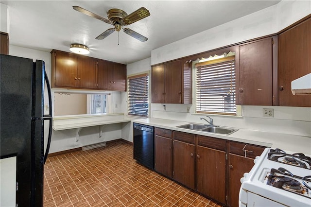 kitchen featuring dark brown cabinetry, ceiling fan, sink, and black appliances