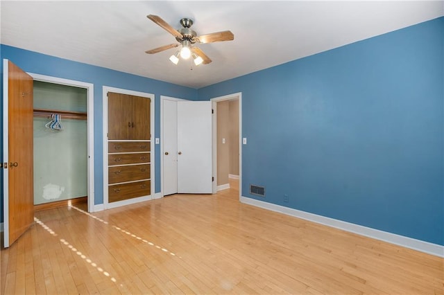 unfurnished bedroom featuring ceiling fan and wood-type flooring