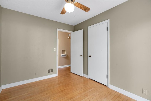 unfurnished bedroom with ceiling fan and light hardwood / wood-style floors