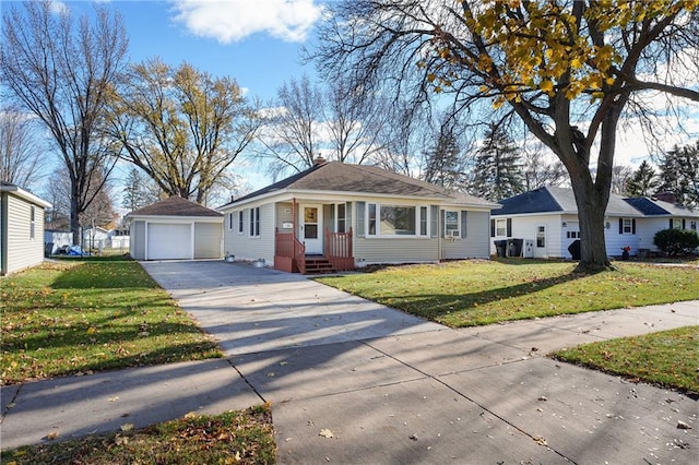 view of front facade with an outbuilding, a garage, and a front lawn