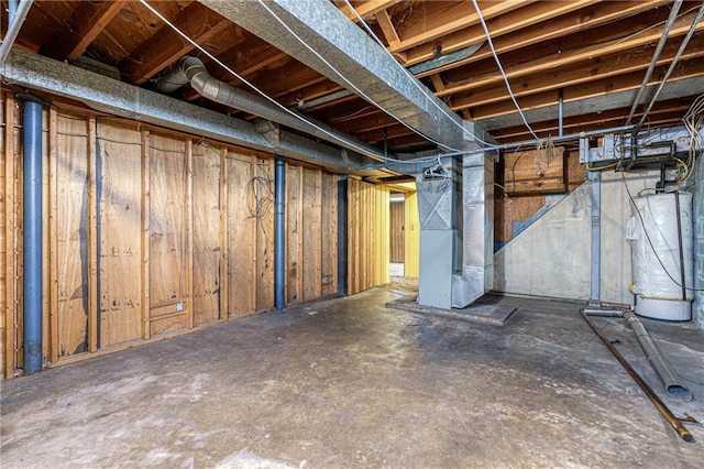 basement with water heater and heating unit