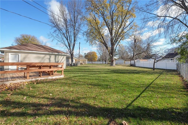 view of yard with a wooden deck