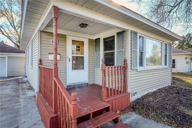 view of exterior entry featuring a porch