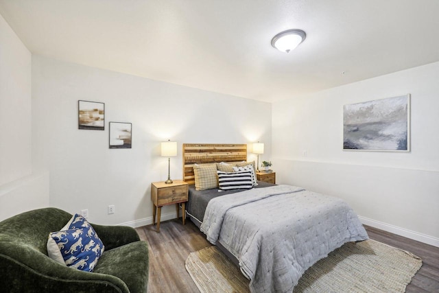 bedroom featuring dark hardwood / wood-style flooring