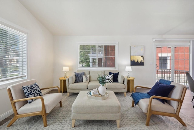 living room featuring a wealth of natural light and hardwood / wood-style flooring