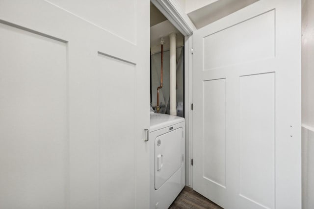 laundry area with dark hardwood / wood-style floors