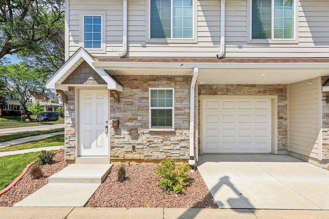 doorway to property featuring a garage