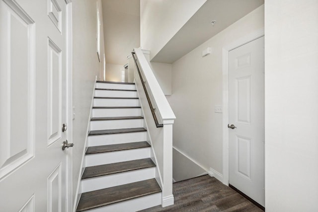 staircase featuring hardwood / wood-style floors