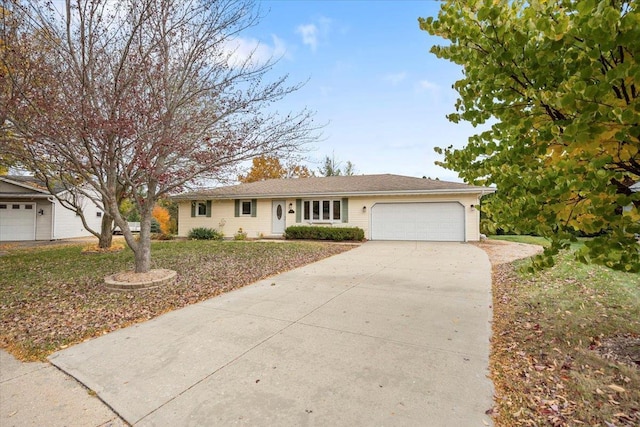 single story home with a garage