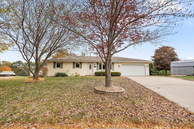 ranch-style house with a garage and a front yard