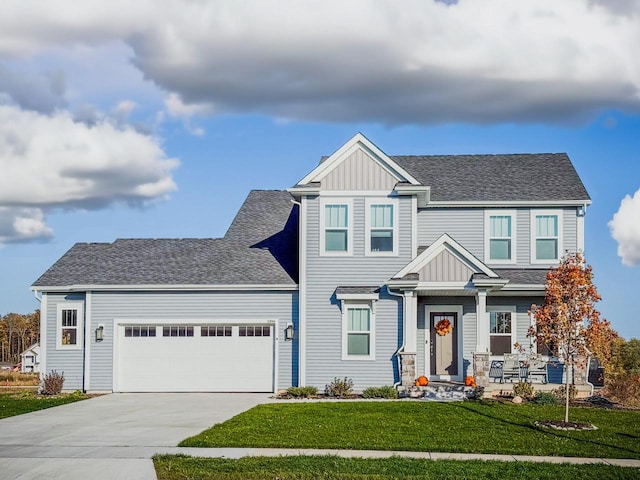 craftsman-style home with a garage and a front yard