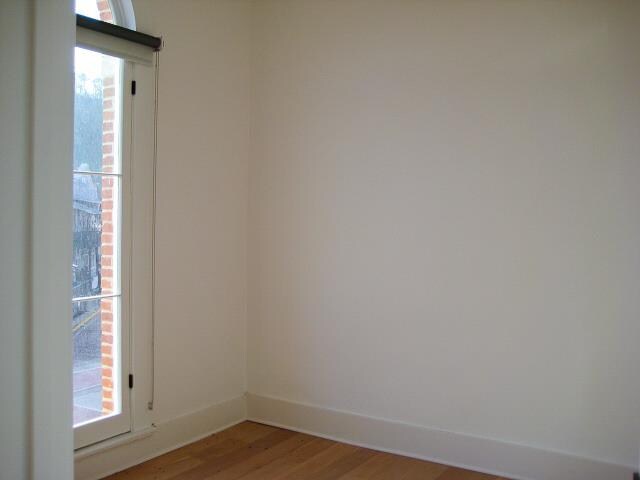 empty room featuring hardwood / wood-style floors